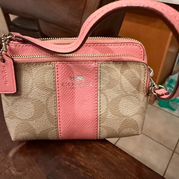 Coach Handbags - Coach Pink and Tan Signature Canvas Wristlet Crossbody